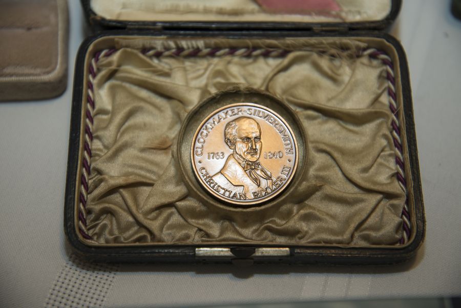 A commemorative medal in its case