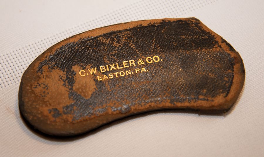 A leather pouch stamped C.W. Bixler and Co., Easton