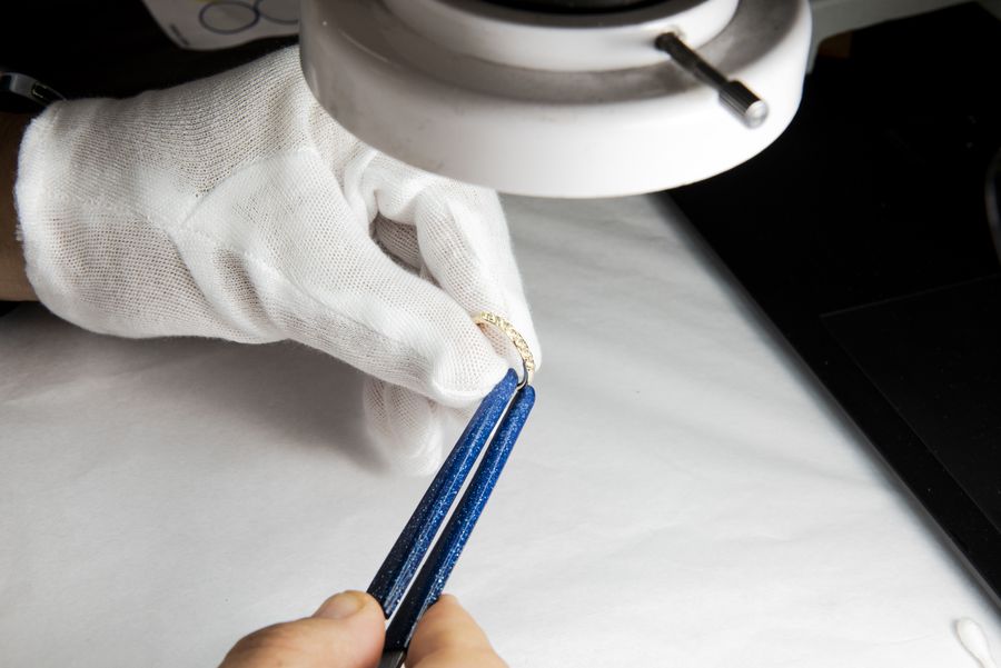 Checking a stone in gloved hands