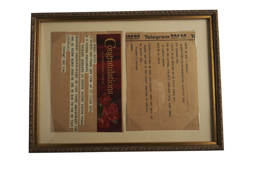 A framed telegram of congratulations